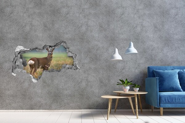 Adesivo con vista dietro il muro Capriolo nel suo habitat naturale