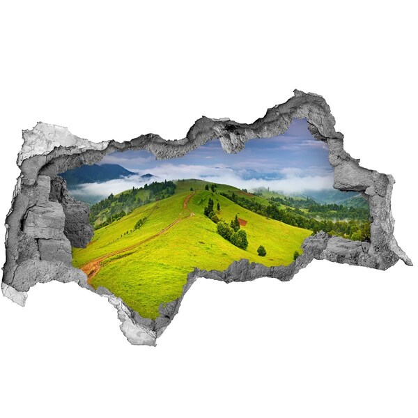 Sticker effetto rottura muro Colline verdi tra le nuvole