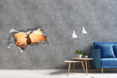 Adesivo con vista dietro il muro Cervi nella luce dorata del tramonto