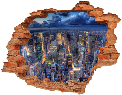 Adesivo effetto buco nel muro Lo skyline di New York di notte