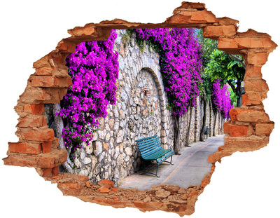 Adesivo con buco sbrecciato Viale fiorito nel muro di pietra