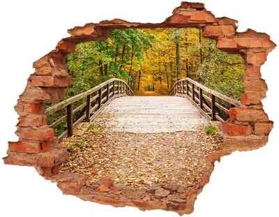 Adesivo con buco sbrecciato Un ponte nella foresta autunnale