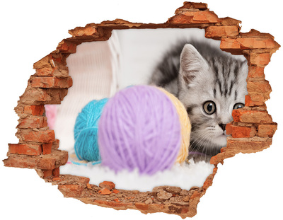 Adesivo effetto buco nel muro Il gattino dietro il muro